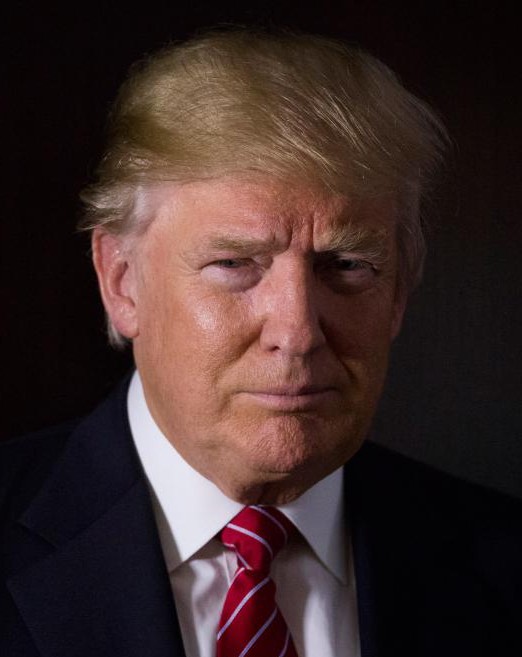 Donald Trump, president and chief executive of Trump Organization Inc. and 2016 Republican presidential candidate, stands for a photograph after a Bloomberg Television interview at his campaign headquarters in Trump Tower in New York, U.S., on Thursday, Oct. 15, 2015. According to Trump, Janet Yellen's decision to delay hiking interest rates is motivated by politics. Photographer: John Taggart/Bloomberg via Getty Images *** Local Capton *** Donald Trump
