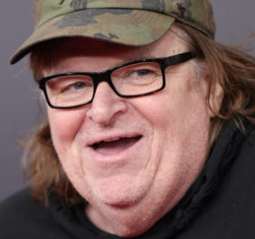 Filmmaker Michael Moore attends the premiere of "The Hateful Eight" at the Ziegfeld Theatre on Monday, Dec. 14, 2015, in New York. (Photo by Evan Agostini/Invision/AP)